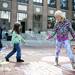 Lilly Bryan, 8, walks around chalk drawing during P.E.A.C.E. Day on Sunday. Daniel Brenner I AnnArbor.com